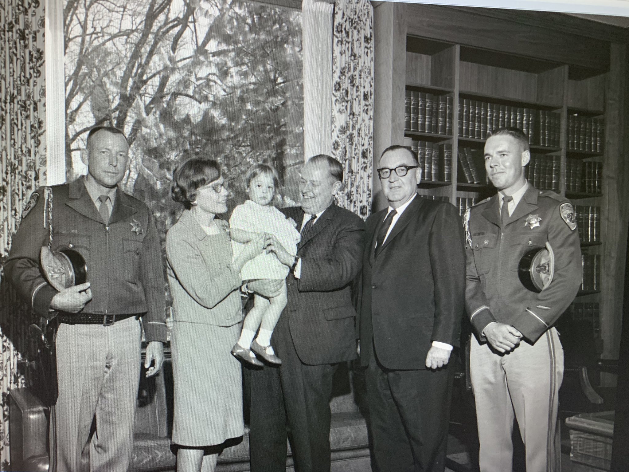 Police officer, Mrs. Champion, their daughter, Director
                      Champion, Governor Edmund Brown Sr., police officer.