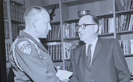 governor brown police officer shaking hands