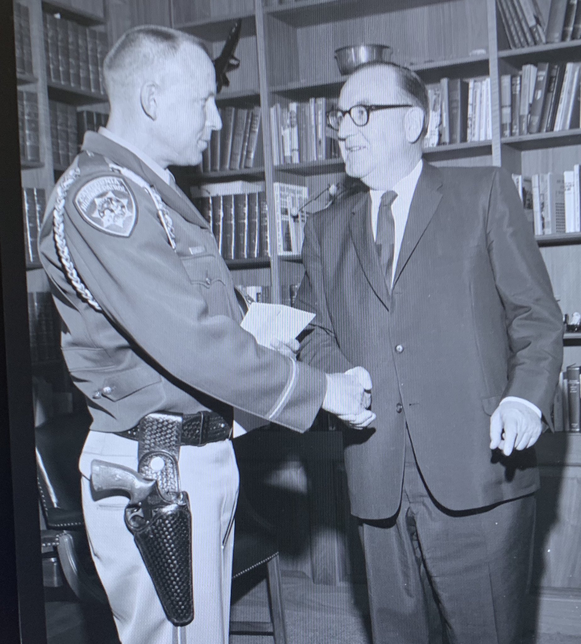 governor brown police officer shaking hands